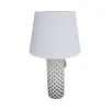 The white lampshade is paired with a black cylindrical lamp base featuring star-shaped patterns Item Picture